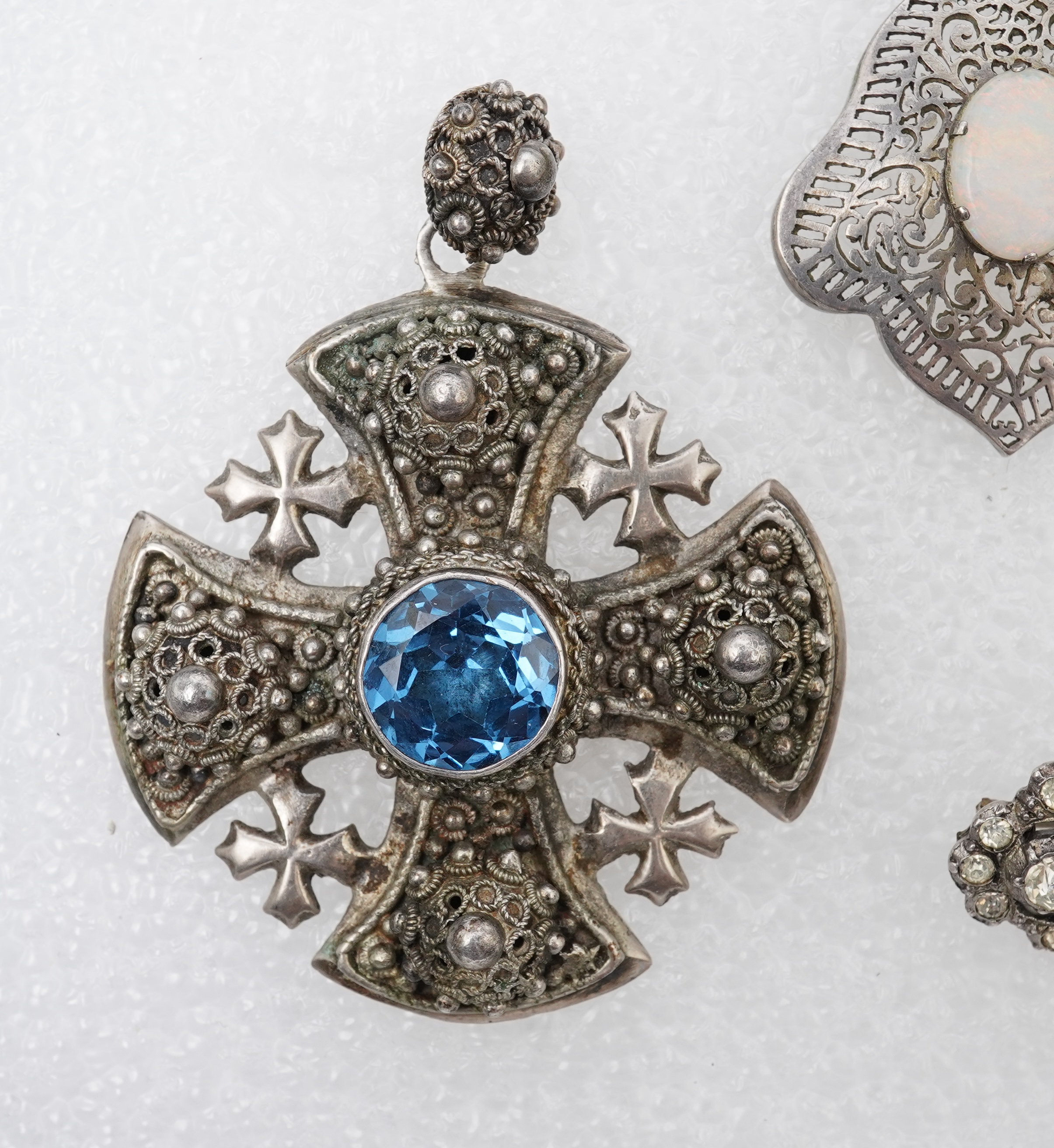 A group of jewels, comprising: a late 19th century and later Renaissance revival-style pendant set with an oval turquoise cabochon, circular-cut garnets and circular-cut green chalcedony, mounted in silver, length 6cm, s
